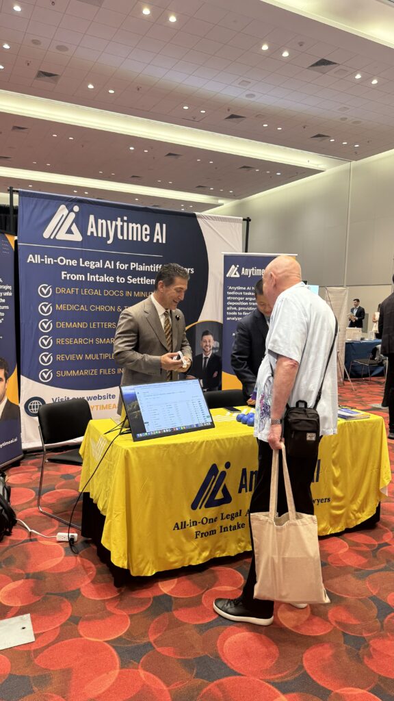 John Blake, VP of Revenue of Anytime AI speaking to people during the Convention 